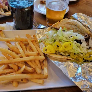 a plate of french fries and a sandwich