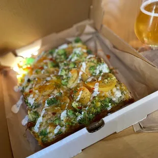 a glass of beer in a box