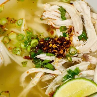 Khao Piak  12    
Lao homemade noodles with chicken breast soup topped with cilantro and green onions.