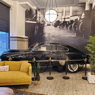 a black and white photo of a classic car