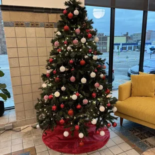a decorated christmas tree in a coffeehouse