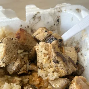 a bowl of rice and meat