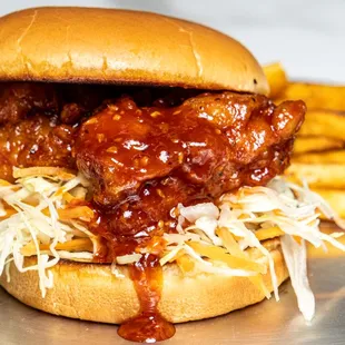 Crispy chicken smothered in our secret sauce served on top of
slaw and finished with our yummy sauce.