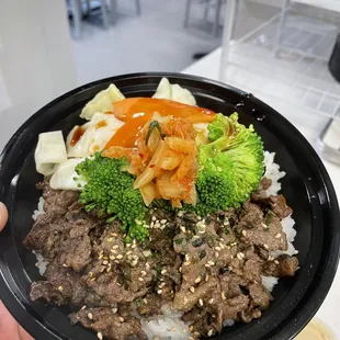 Classic!  Thinly sliced ribeye marinated in our house special blend served on steamed rice and topped with steamed veggies and kimchi.