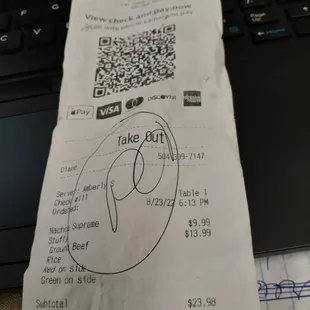 a receipt on a laptop keyboard