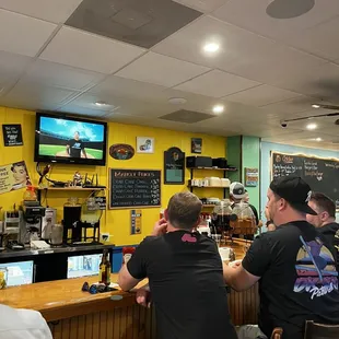 two men sitting at the bar