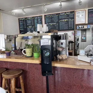 a coffee shop counter with a coffee machine