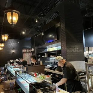 Working at the sushi bar- note 4 rollers!!