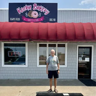 Satisfied customer outside Koehn&apos;s family bakery &amp; sandwich shop