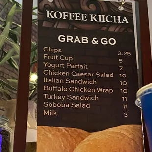 a menu and a cup of coffee