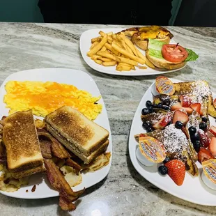 two plates of breakfast food