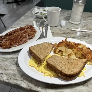 Scrambled eggs home fries toast corned beef hash