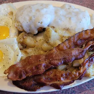Country Breakfast. 2 eggs, 2 biscuits and gravy, choice of bacon or sausage, and homefries or grits.