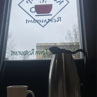 Front window with an order of coffee. Yes, coffee comes in a carafe so you can serve yourself hot coffee.
