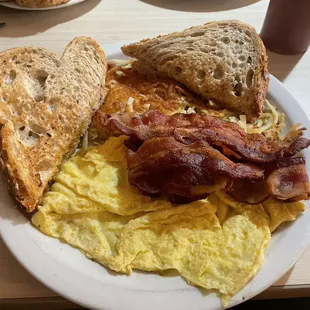 Two eggs, meat and potatoes