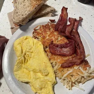 Two eggs, meat and potatoes, with a side of their delicious cracked wheat toast