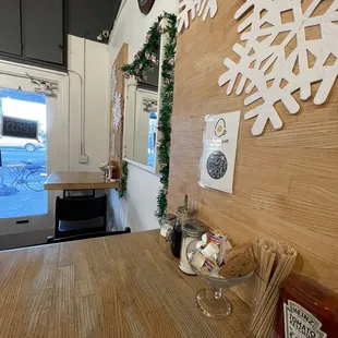 High top tables lining the side of the store