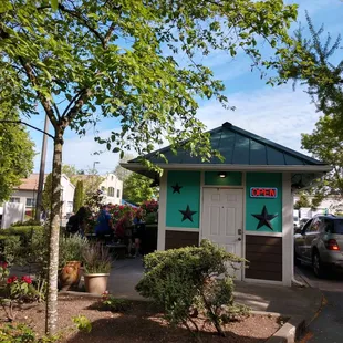 a small building with a star painted on it