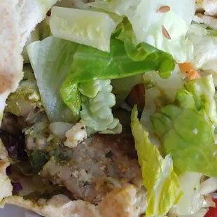 Spicy Masala chicken in a pita wrap with salad instead of fries.
