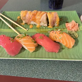 Large Hawaiian Roll that&apos;s half eaten because I couldn&apos;t help myself and an order of tuna and salmon nigiri. Highly recommend this place