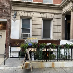 a sign in front of a building