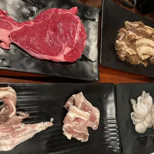 Rib Eye, Marinated La Galbi, Thinly Sliced Pork Belly, and Baby Octopus at Kogi Gogi BBQ in San Francisco.