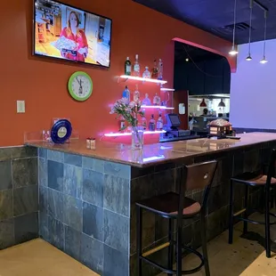 a bar with stools