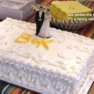 a wedding cake with a bride and groom figurine