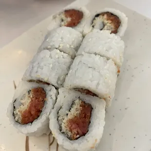 four pieces of sushi on a plate