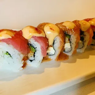 Mushu Roll - Spicy Shrimp, Cream Cheese, Avocado, Salmon, Tuna, jalapeños, spicy Mayo, and sweet chili sauce