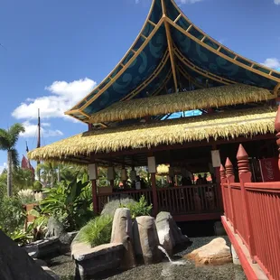 Pretty building architecture surrounded by water at Kahola Reef Social Club Restaurant, Volcano Bay Orlando