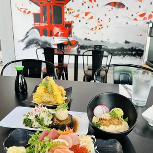 a plate of sushi and a bowl of rice