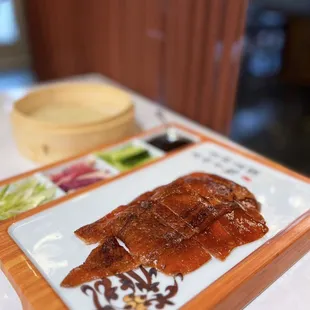 Apple Wood Smoked Peking Duck: Farm Duck, Radish, Cucumber, Leek, Pancake | $38