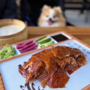 Applewood Smoked Peking Duck w/ leeks, radish, cucumber, hoisin sauce, pancakes | $38