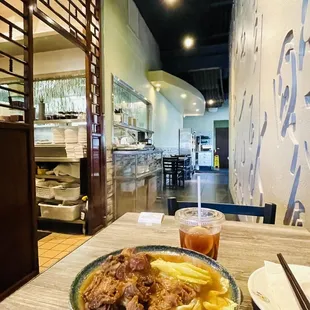 a bowl of soup and chopsticks on a table