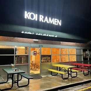 the front of the restaurant at night