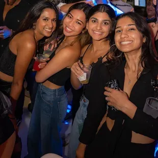 a group of women posing for a picture