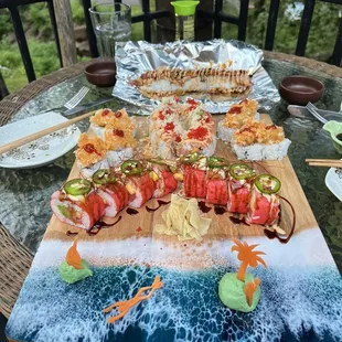 a variety of sushi on a cutting board