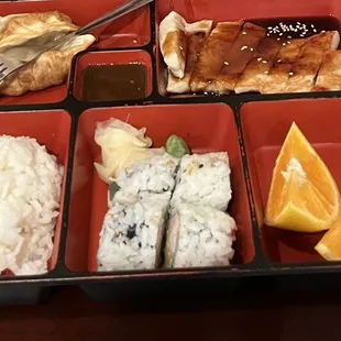 a bento box with a variety of food items