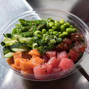 Koibito Signature Bowl - Salmon, Hawaiian tuna, &amp; ahi tuna, sriracha aioli, cucumber, edamame, cilantro, seaweed salad, &amp; sesame seeds.