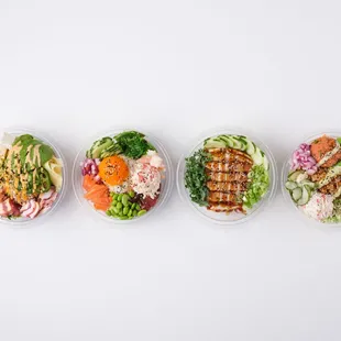 a variety of poke poke bowls
