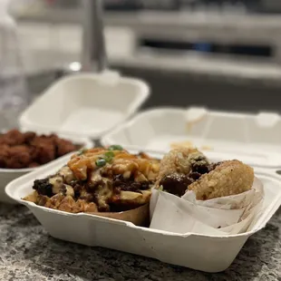 a variety of food in a styrofoam container