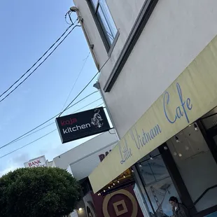 Signage of KoJa Kitchen &amp; the Yellow awning of Little Vietnam Cafe!