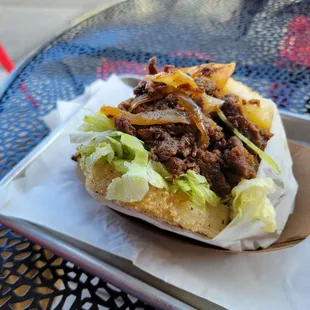 Koja Beef Burger: beef between rice pads, when ordered without red sauce it is gluten-free