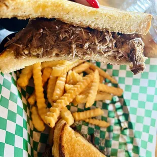 Chuck roast, meunster cheese, &amp; grilled onions on Texas toast with fries