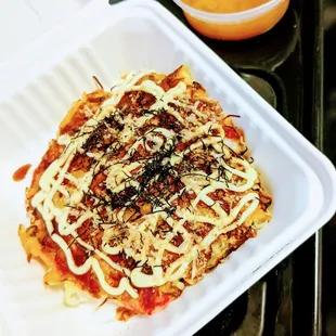 Okonomiyaki, a delicious savory pancake, some call it Japanese pizza.