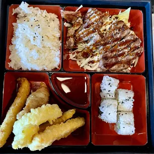 Beef Teriyaki Bento - Beef, house teriyaki sauce, shrimp &amp; veggie tempura, ginger salad, miso soup, steamed rice, California roll.