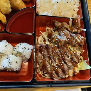 Beef Teriyaki Bento - Beef, house teriyaki sauce, shrimp &amp; veggie tempura, ginger salad, miso soup, steamed rice, California roll.