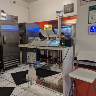 Simple and clean kitchen. You can see the food being made.