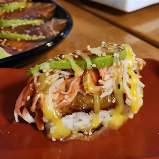 a close up of a hot dog on a red plate